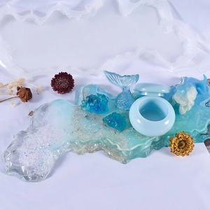 Detailed close-up of blue ocean-themed resin tray set with glitter and sand texture