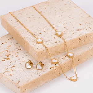 Elegant gold stainless steel heart necklace and earring set with white mother of pearl