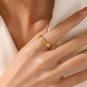 Irregular gold-plated wavy adjustable ring with a modern molten lava texture design