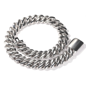 Macro view of 20mm silver Cuban link necklace with iced out cubic zirconia pavé setting