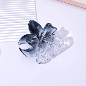 Detail of 8cm blue gradient translucent plumeria hair claw clip with glossy finish