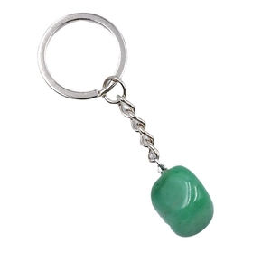 Irregular natural green crystal stone keychain with silver metal ring on white background