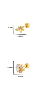 Detail view of gold stud earrings with leaf and floral zircon patterns and size labels