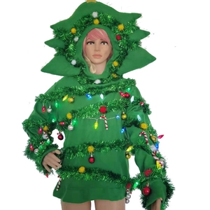 Close-up of green knitted Christmas tree hoodie with festive LED lights and colorful ornaments