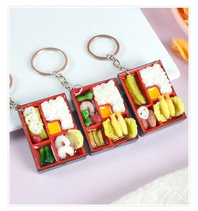 Miniature Japanese bento box keychain with detailed resin food models and metal ring