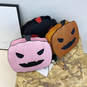 Three pumpkin crossbody bags with sequin finish and gold metal chains for Halloween