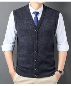 Detailed view of dark blue V-neck knit vest with subtle argyle texture and button-up front
