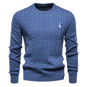 Detail of navy blue cable knit sweater with white giraffe embroidery on chest