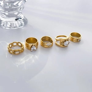Set of five 18K gold plated titanium steel rings with oval and teardrop cubic zirconia