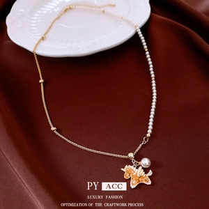 Luxury zircon pearl necklace with golden unicorn pendant on elegant red satin background