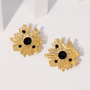 Irregular gold radial earrings with black beads in a vintage French luxury design style
