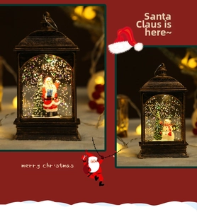 Close-up of vintage bronze Christmas lanterns with Santa and snowman scenes