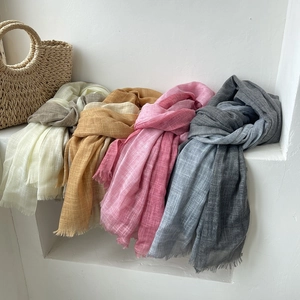 Elegant gradient cotton linen scarves with fringe, displayed in beige, yellow, pink, and grey