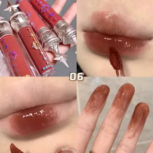 Detail view of mirror finish lip glaze shade 06 with glossy tea-red color and star tube