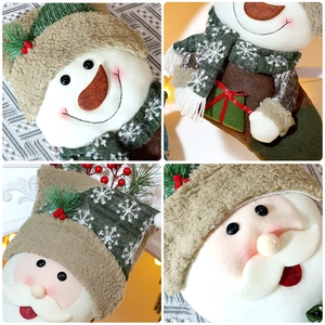 Close-up of embroidery and plush textures on Santa and snowman Christmas stockings