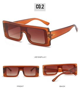 Detailed views of amber transparent oversized flat top sunglasses with gradient lenses