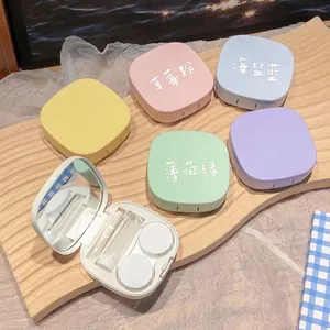 Portable macaron color contact lens case set with mirror, tweezers and solution bottle
