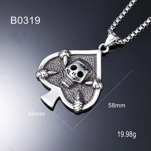 Macro detail of men's punk skull spade pendant showing 58mm by 48mm dimensions