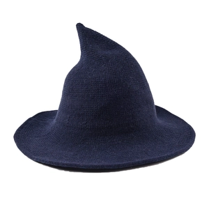 Fashionable dark blue knitted witch hat with a wide brim and tall pointed top