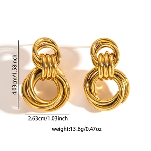 Macro shot of gold titanium steel hollow earrings with size and weight dimensions