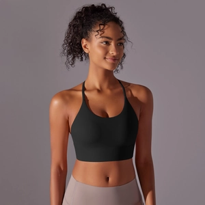 Close-up of black halter yoga bra with wide underband for support and soft matte texture