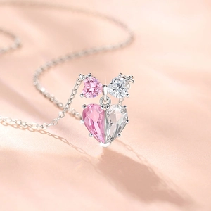 Elegant 925 sterling silver necklace featuring pink and white heart-shaped bow pendant