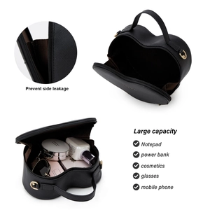 Macro view of heart-shaped leather bag with large capacity and gold zipper details