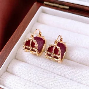 18K gold-plated vintage hollow leather hoop earrings with intricate crown pattern