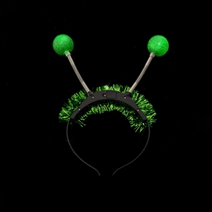 Detail of green glitter ball antennas on black headband with silver springs for parties