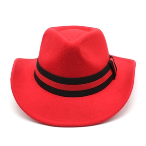 Detail of red wool felt cowboy hat featuring a textured crown and striped ribbon band
