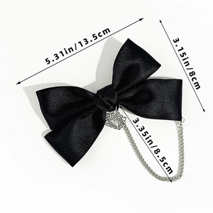 Detailed size view of black satin bow hairclip with silver crown and metal chains