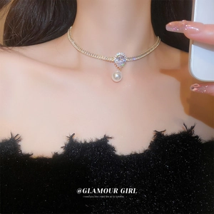 Close-up of a French style floral heart choker necklace with pearls and rhinestones