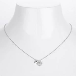 Detail of S925 sterling silver double heart necklace with sparkling zircon on a mannequin