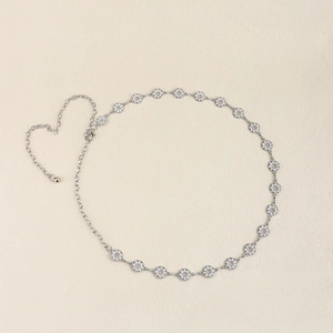Close-up of silver metal waist chain featuring sparkling rhinestones and a lobster clasp