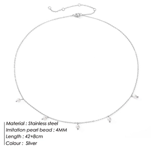 Detail of stainless steel necklace featuring five 4mm faux pearls on a silver chain
