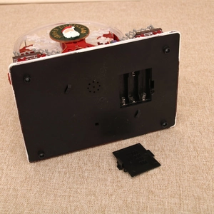 Detail view of the Christmas ferris wheel music box battery compartment and base