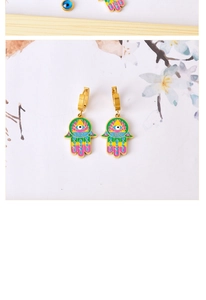 Detail of Hamsa Hand and Evil Eye earrings with colorful enamel on gold-plated hoops