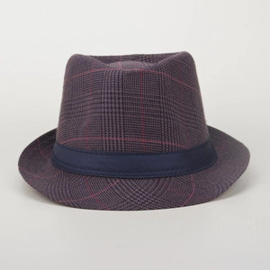 Detail of dark purple plaid fedora hat with navy blue satin ribbon and classic check pattern