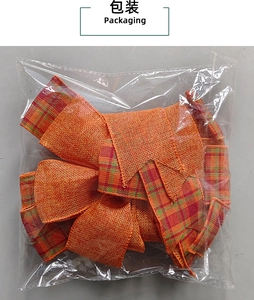 Detail view of orange plaid burlap decorative bow in clear plastic packaging