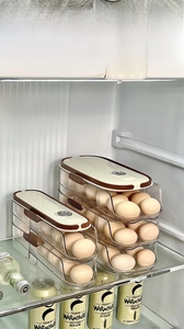Close-up of a double-layer sliding egg organizer with a manual freshness date tracker