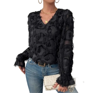 Detail of elegant black long sleeve blouse with textured tassel feather material and V-neck