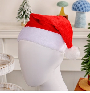 Close-up of a red velvet Christmas hat with white plush trim on a mannequin head