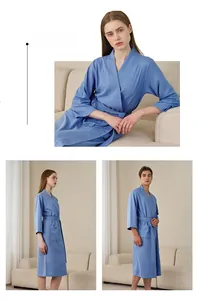 Detail of sky blue waffle robe showing absorbent cotton texture and kimono style collar