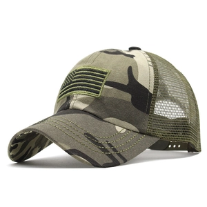 Detail of camouflage tactical baseball cap featuring embroidered American flag patch