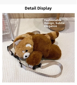 Close-up of plush red panda bag featuring golden metal zipper and adjustable beige strap