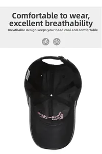Internal detail of a black baseball cap with premium embroidery and metal buckle strap