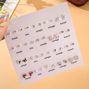 Set of 20 pairs pearl stud earrings with heart butterfly and flower designs on card