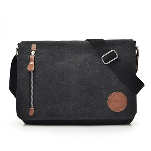 Classic black canvas messenger bag for men with brown leather accents and adjustable strap