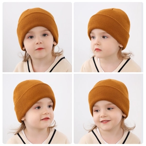 Detailed view of children's ginger rib-knit beanie hat perfect for autumn and winter