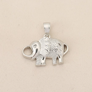 Detail shot of a silver elephant pendant showing textured metal finish and jump ring